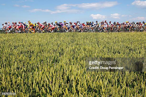 The peloton passes through wheat fields during stage four of the 2012 Tour de France from Abbeville to Rouen on July 4, 2012 in Veules-les-Roses,...