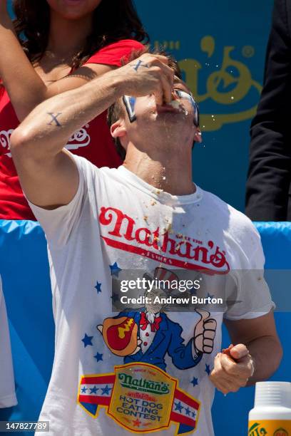 Competitive eater Tim Janus competes in the men's division of the Nathan's Famous International Hot Dog Eating Contest at Coney Island on July 4,...