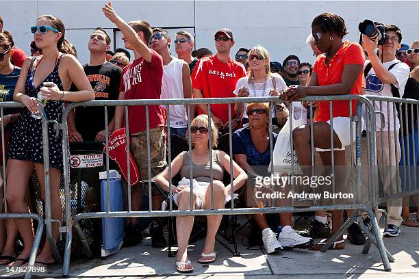 People wait to watch the Nathan's Famous International Hot Dog Eating Contest at Coney Island on July 4, 2012 in the Brooklyn borough of New York...