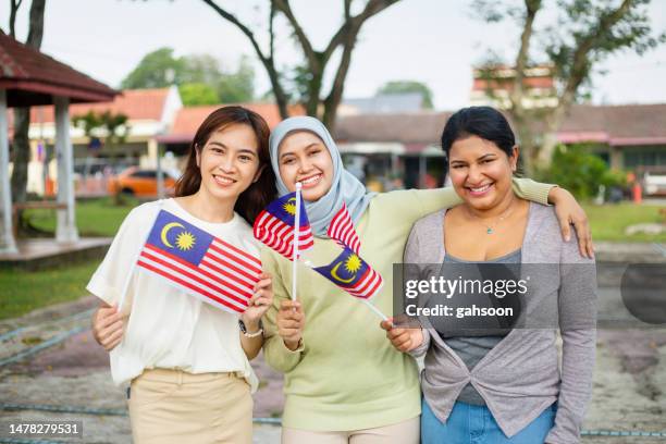 group of friends celebrating malaysia independence day - malay people stock pictures, royalty-free photos & images