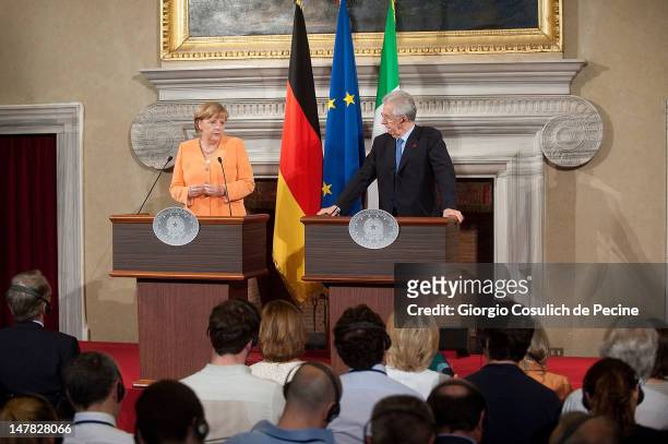 German chancellor Angela Merkel and Italian Prime Minister Mario Monti attend a press conference at the end of a bilateral meeting at Villa Madama on...