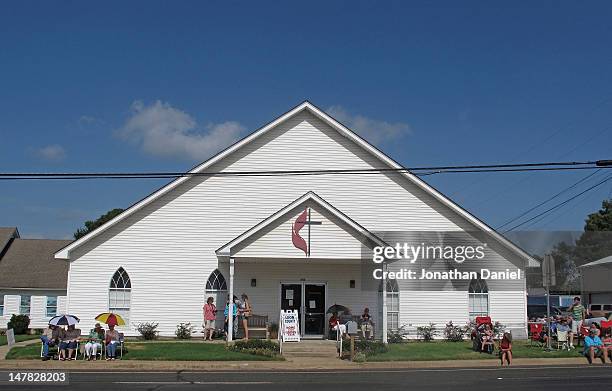 Residents in front of a church wait for the start of the Independence Day parade on July 4, 2012 in Centerville, Texas. This year marks the 236th...