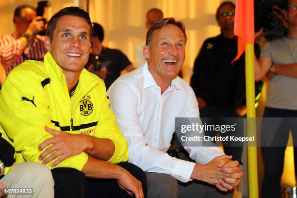 Sebastian Kehl and Chairman Hans-Joachim Watzke, chairman of Borussia Dortmund laugh during the Borussia Dortmund Puma kit launch at Westfaelischer...