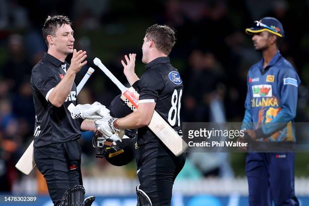 Will Young and Henry Nicholls of New Zealand celebrate followinggame three of the One Day International series between New Zealand and Sri Lanka at...