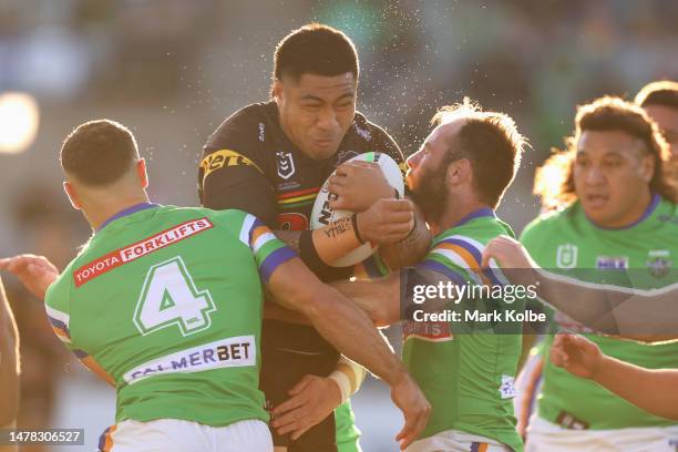 Moses Leota of the Panthers is tackled during the round five NRL match between Canberra Raiders and Parramatta Eels at GIO Stadium on March 31, 2023...