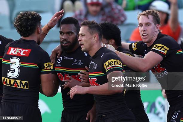 Sunia Turuva of the Panthers celebrates scoring a try with team mates during the round five NRL match between Canberra Raiders and Parramatta Eels at...