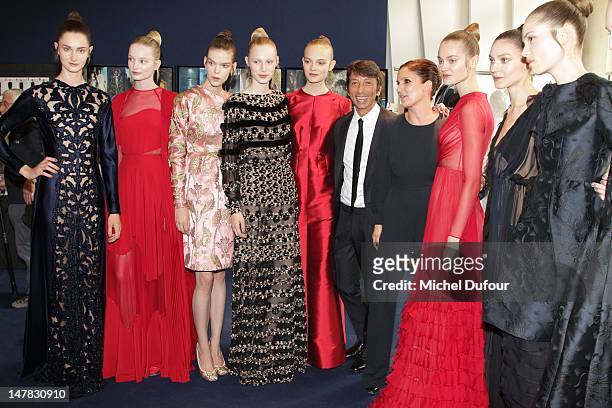 Pier Paolo Piccioli and Maria Grazia Chiuri pose with models as they attend the Valentino Haute-Couture Show as part of Paris Fashion Week Fall /...