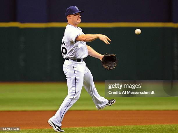 Infielder Brooks Conrad of the Tampa Bay Rays throws from third base against the New York Yankees July 4, 2012 at Tropicana Field in St. Petersburg,...