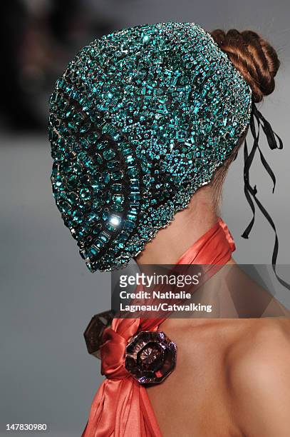 Model walks the runway at the Maison Martin Margiela Autumn Winter 2012 fashion show during Paris Haute Couture Fashion Week on July 4, 2012 in...