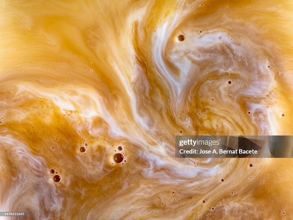 Full frame of a freshly brewed cup of latte.