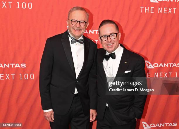 Australian Prime Minister Anthony Albanese stands with Qantas CEO Alan Joyce as they attend the Qantas 100th Gala Dinner at Jetbase 96 hangar at...