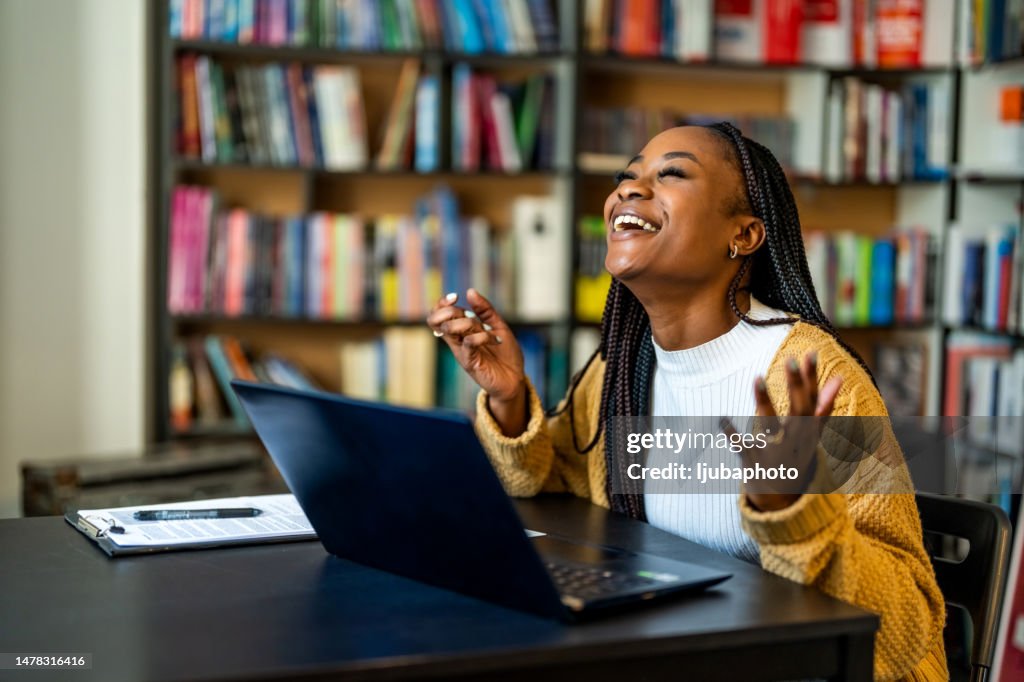 Excited female feeling euphoric celebrating online win success achievement result