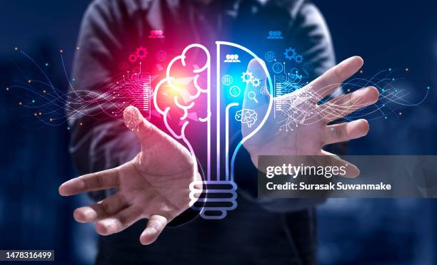 innovation. new concept ideas with innovations hand in hand with future lamp technology and inspiration in science and communication concepts. - modernismo imagens e fotografias de stock