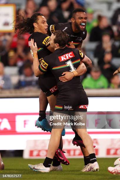 Jarome Luai , Dylan Edwards and Sunia Turuva of the Panthers celebrate with Izack Tago of the Panthers after he scored a try during the round five...