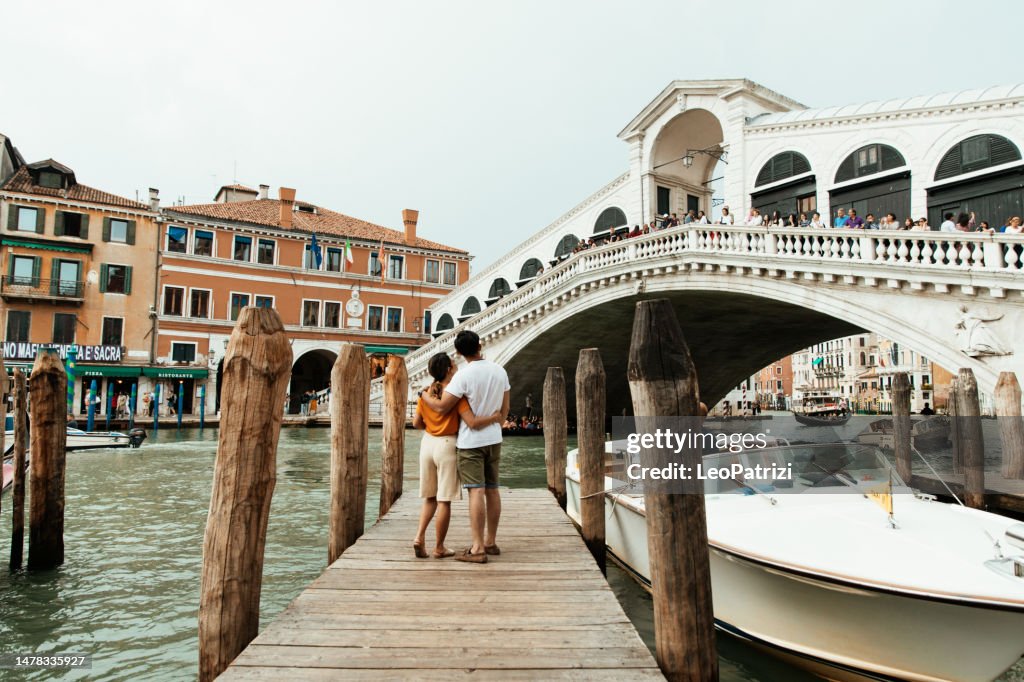 Romantic asian couple in honeymoon in Venice, Italy