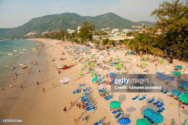 chairs and umbrella at the patong beach from bird eye's view, phuket, thailand - thailand hotel stock pictures, royalty-free photos & images