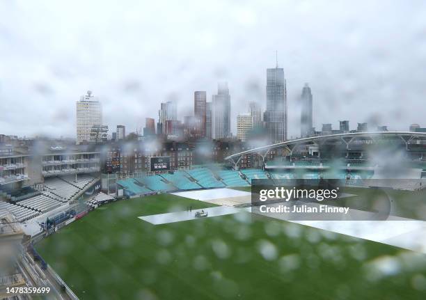 General view of rain covered on a window as rain delays play at The Oval on March 31, 2023 in London, England.