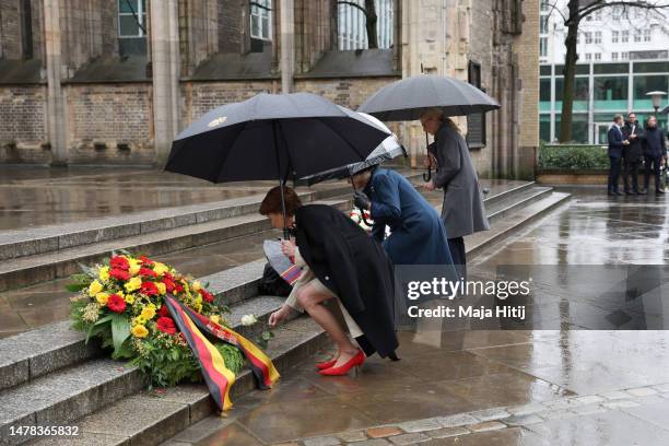 First Lady Elke Buedenbender, Camilla, Queen Consort and Eva-Maria Tschentscher place wreaths on the steps of St. Nikolai Memorial Church on March...