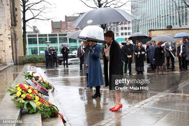 First Lady Elke Buedenbender, Camilla, Queen Consort and Eva-Maria Tschentscher place wreaths on the steps of St. Nikolai Memorial Church on March...