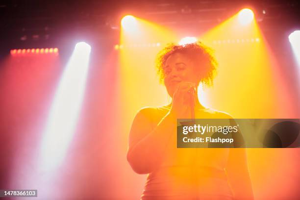 music band on stage. - entertainer stock pictures, royalty-free photos & images