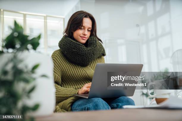 freelancer using laptop at home - low angle view laptop stock pictures, royalty-free photos & images
