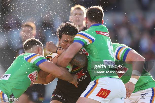 Brian To’o of the Panthers is tackled during the round five NRL match between Canberra Raiders and Parramatta Eels at GIO Stadium on March 31, 2023...
