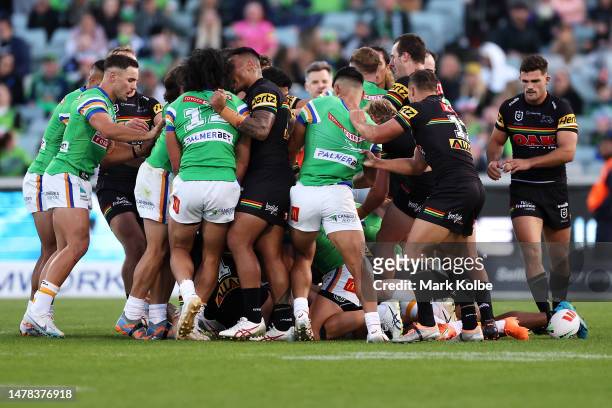Players scuffle during the round five NRL match between Canberra Raiders and Parramatta Eels at GIO Stadium on March 31, 2023 in Canberra, Australia.