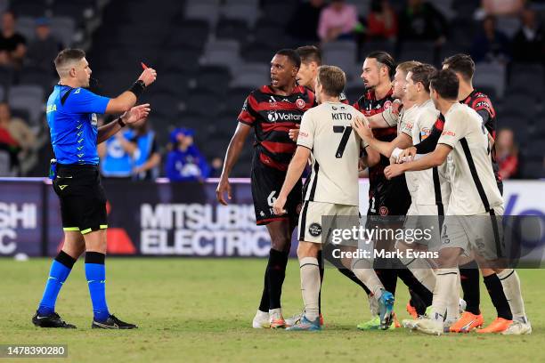 Referee Shaun Evans gives Marcelo Guedes of the Wanderers a red card during the round 22 A-League Men's match between Western Sydney Wanderers and...