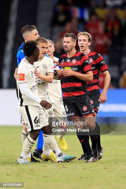Nestory Irankunda of Adelaide United is held back from Calem Nieuwenhof of the Wanderers during the round 22 A-League Men's match between Western...