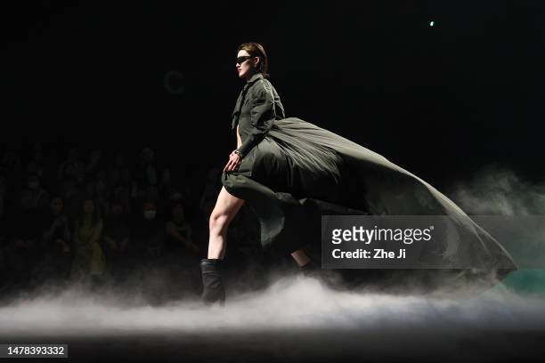 Model walks the runway at Shengze Fashion Show by designer Wei Liu during the day eight of China Fashion Week AW23 at 751 D.Park on March 31, 2023 in...