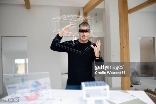 architect examining model home at construction site - demolition site stock illustrations