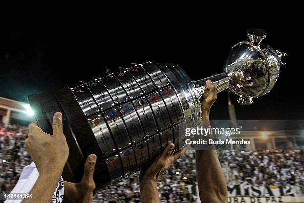 Players of Corinthians hold up the trophy during the celebration of the title after the second leg of the final of the Copa Libertadores 2012 between...