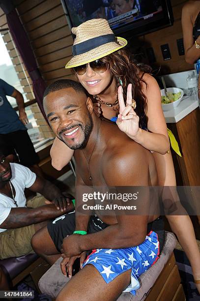 Rashad Evans and Rachelle Leah attend a pool party as part of the International Fight Week festivities at Marquee Day Club at the Cosmopolitan on...