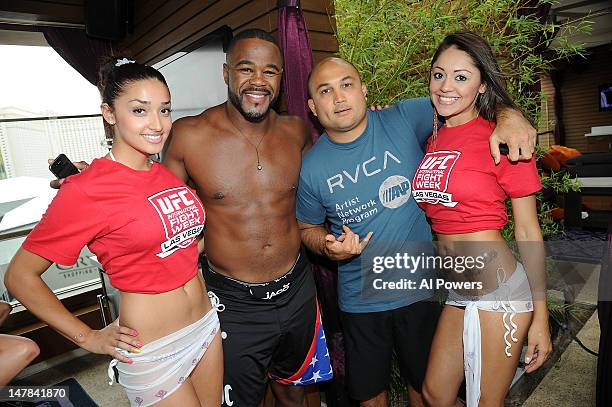 Fighters Rashad Evans and BJ Penn attend a pool party as part of the International Fight Week festivities at Marquee Day Club at the Cosmopolitan on...