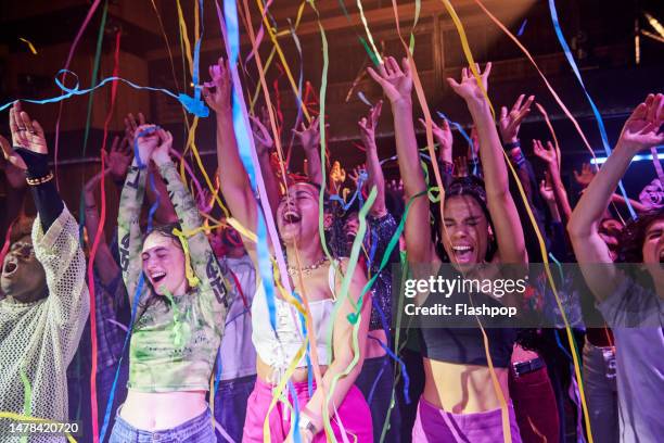 group of people dancing at a music venue. - konzerthaus stock-fotos und bilder