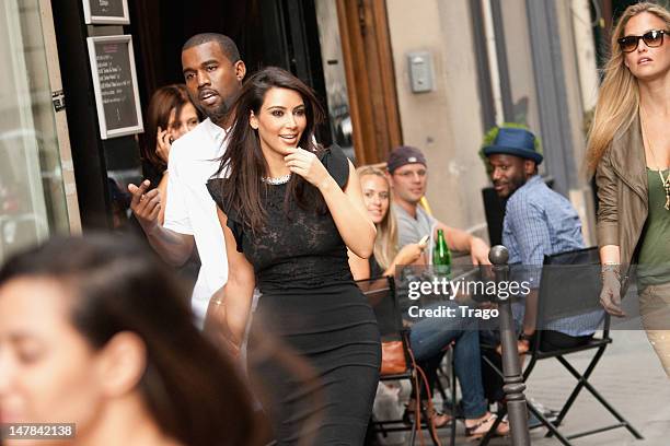 Kanye West and Kim Kardashian leave the Valentino Haute-Couture Show as part of Paris Fashion Week Fall / Winter 2013 at Hotel Salomon de Rothschild...