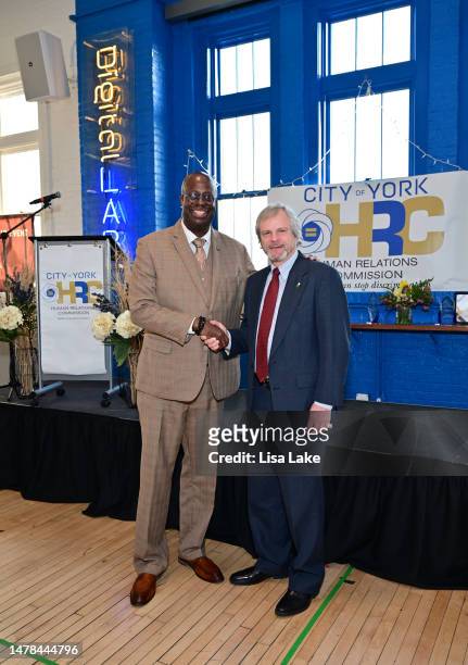 Chad Dion Lassiter, Executive Director, Pennsylvania Human Relations Commission and The Honorable Michael Helfrich, Mayor of York attend The City of...