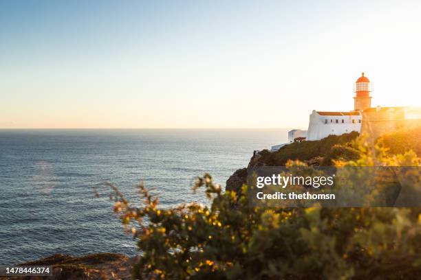 lighthouse of cabo de são vicente against sunset, algarve, portugal - sagres ストックフォトと画像