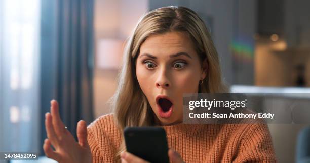 shocked woman, face or what for phone scam, phishing email or security fail in house living room. wow, anxiety or surprised person on mobile communication technology with hacker glitch or cyber theft - choque imagens e fotografias de stock