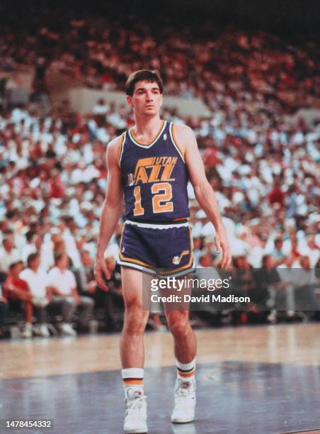 John Stockton of the Utah Jazz plays in an NBA game against the Phoenix Suns on April 9, 1990 at the Arizona Veterans Memorial Coliseum in Phoenix,...