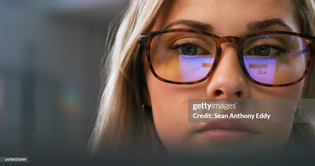 Serious woman, face or glasses for screen reflection in software coding, ux programming or digital website planning at night. Closeup, programmer or developer with vision eyewear for late technology