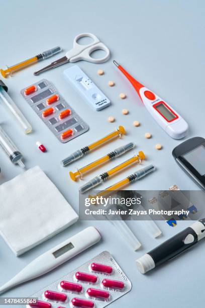 still life knolling of medical supplies on blue colored background - laboratory equipment stock pictures, royalty-free photos & images