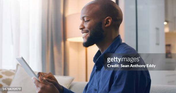 relax, tablet and smile, black man in living room reading email, freelance website or networking online. technology, communication and remote work, person on sofa surfing mobile app or social media. - free download photo stock pictures, royalty-free photos & images