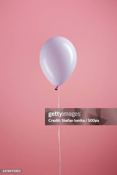 close-up of pink balloon against pink background,romania - single object stock pictures, royalty-free photos & images