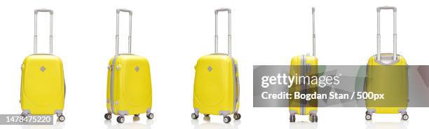 close-up of yellow chairs against white background,romania - equipaje con ruedas fotografías e imágenes de stock