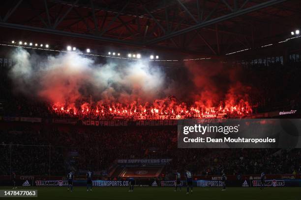 Hamburger SV fans set off flares in the stand during the Second Bundesliga match between Fortuna Düsseldorf and Hamburger SV at Merkur Spiel-Arena on...