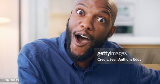 shocked, excited and black businessman surprised by good news in an office at work happy for a deal or sale. winning, winner and portrait of a man employee in celebration of a victory or win - face expressions stock pictures, royalty-free photos & images