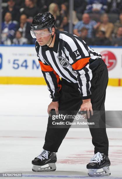 Referee Trevor Hanson works the action between the Florida Panthers and the Toronto Maple Leafs in an NHL game at Scotiabank Arena on March 29, 2023...