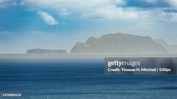 scenic view of sea and mountains against sky,portugal - arquipélago imagens e fotografias de stock