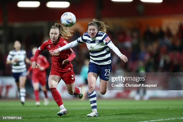 Brooke Gabrielle Denesik of Duisburg challenges Weronika Zawistowska of Koeln during the FLYERALARM Frauen-Bundesliga match between 1. FC Köln and...